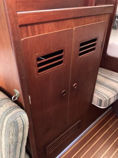 Slide: The Image of 1980 Sceptre 36 wooden cabinet with vented doors in boat interior. - 15