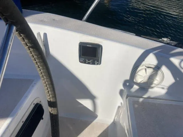 Slide: The Image of Cockpit of a 1980 Sceptre 36 sailboat with steering wheel and navigation equipment. - 21