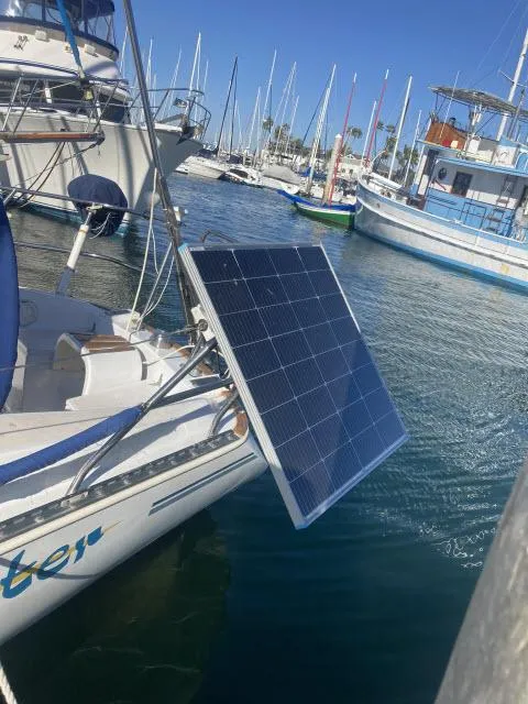 Slide: The Image of Sceptre 36 sailboat (1980) with solar panel in marina, surrounded by other boats. - 30