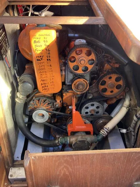 Slide: The Image of 1980 Sceptre 36 engine compartment with maintenance schedule. - 32