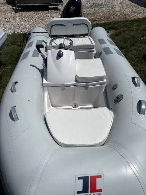 Slide: The Image of 2024 Inmar 320RYS inflatable boat with steering console and seating. - 3
