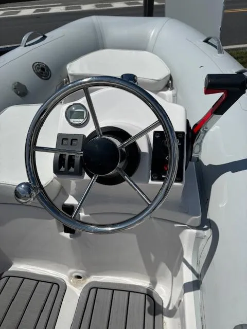 Slide: The Image of 2024 Inmar 360RYS inflatable boat steering console with controls. - 3