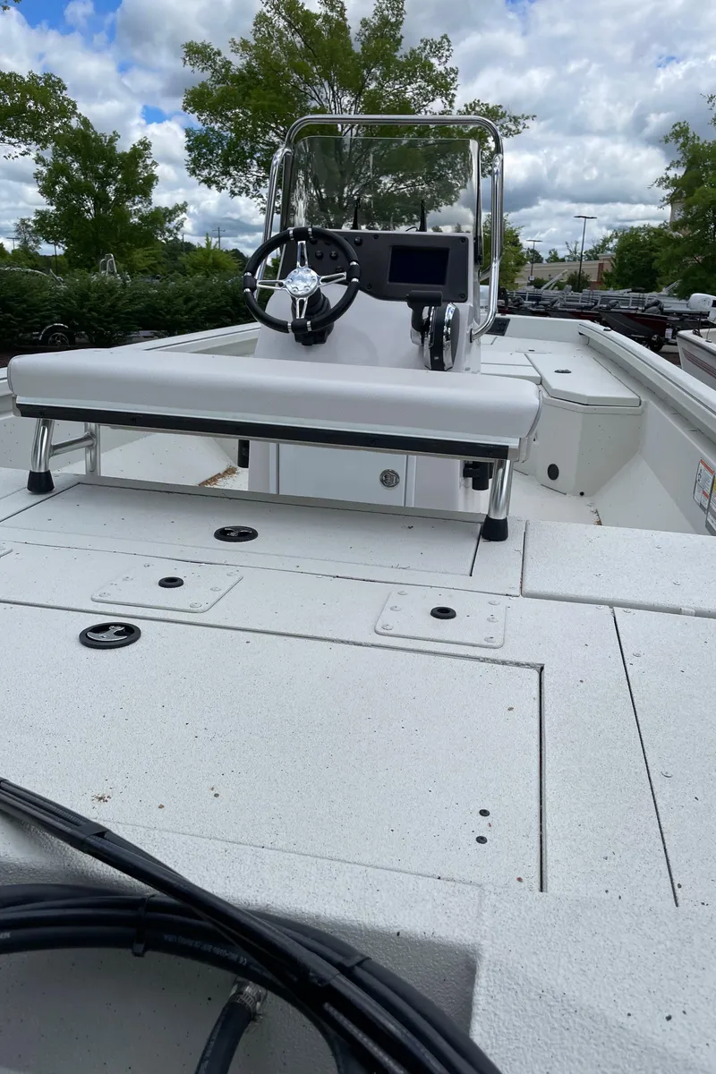 Slide: The Image of 2024 Ranger RB210 boat with center console and spacious deck. - 1