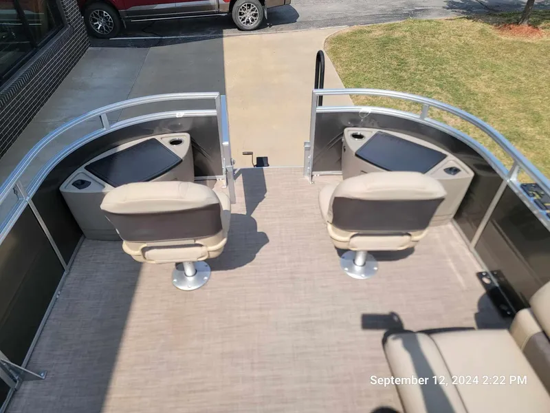 Slide: The Image of 2024 Sun Tracker Fishin' Barge 22 DLX with dual swivel seats and spacious deck. - 3