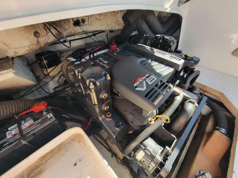 Slide: The Image of 1998 Sea Ray 260 Overnighter boat engine compartment with V8 engine. - 12
