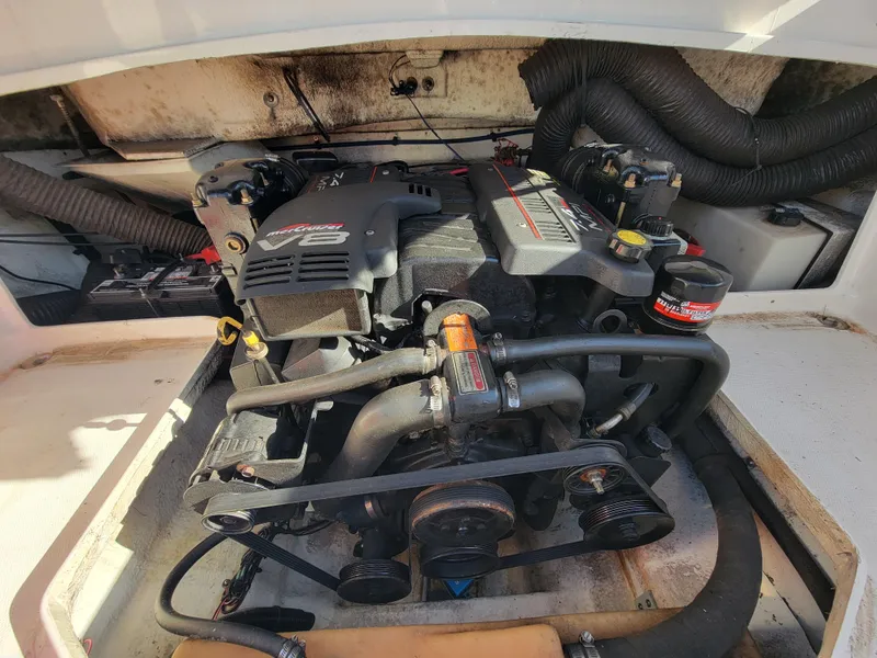 Slide: The Image of 1998 Sea Ray 260 Overnighter engine compartment with visible components and wiring. - 13