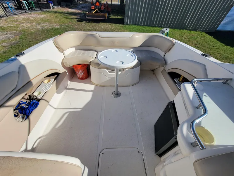 Slide: The Image of 1998 Sea Ray 260 Overnighter boat interior with seating and table. - 9