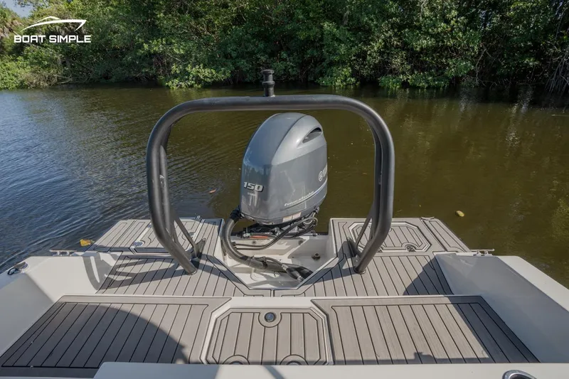 Slide: The Image of 2023 Starcraft SVX 211 OB boat with outboard motor on a calm river. - 10