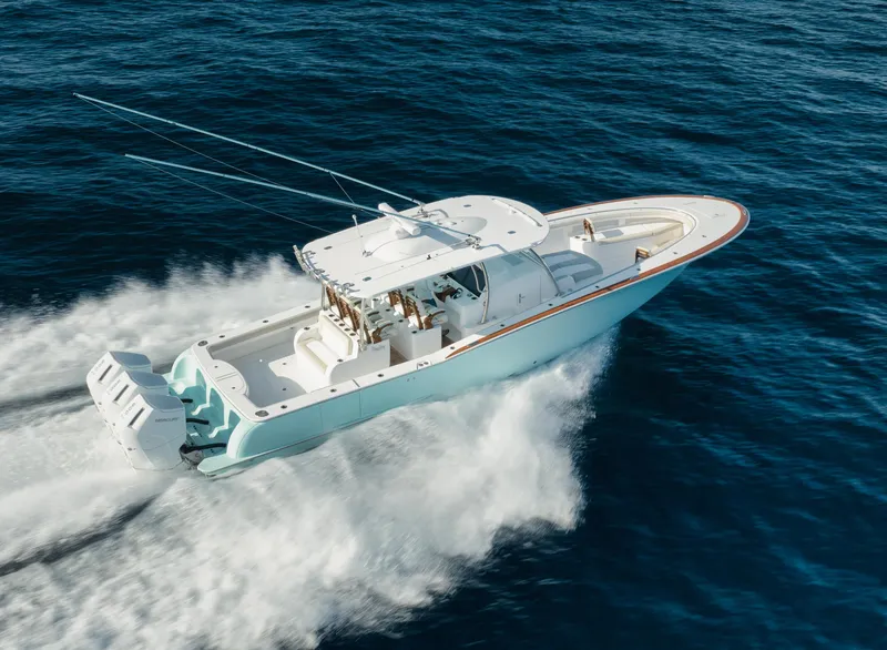 Slide: The Image of 2025 Mag Bay 43 CC boat cruising on open water. - 11