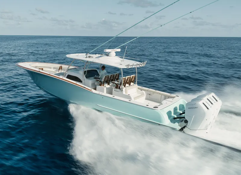 Slide: The Image of 2025 Mag Bay 43 CC boat cruising on open ocean. - 12