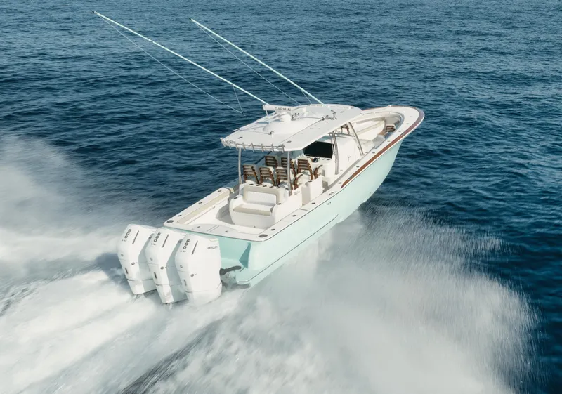 Slide: The Image of 2025 Mag Bay 43 CC boat cruising on open water. - 13