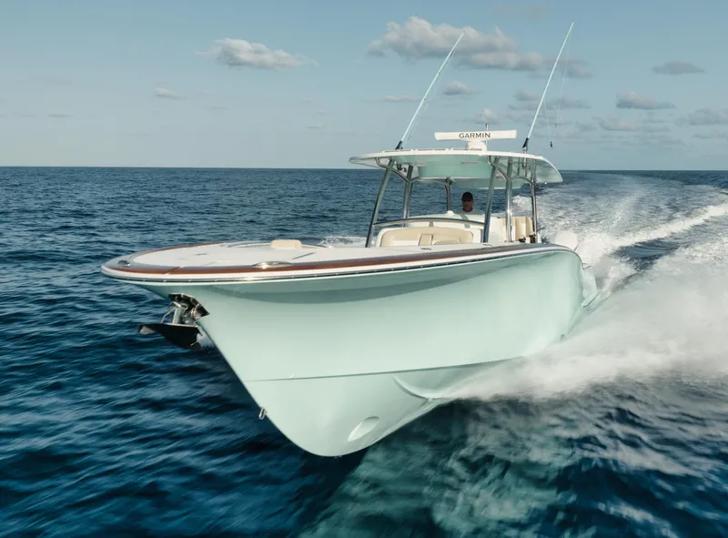 Slide: The Image of 2025 Mag Bay 43 CC cruising on open water. - 14