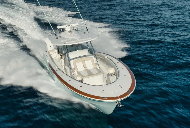 Slide: The Image of 2025 Mag Bay 43 CC cruising on open water. - 15