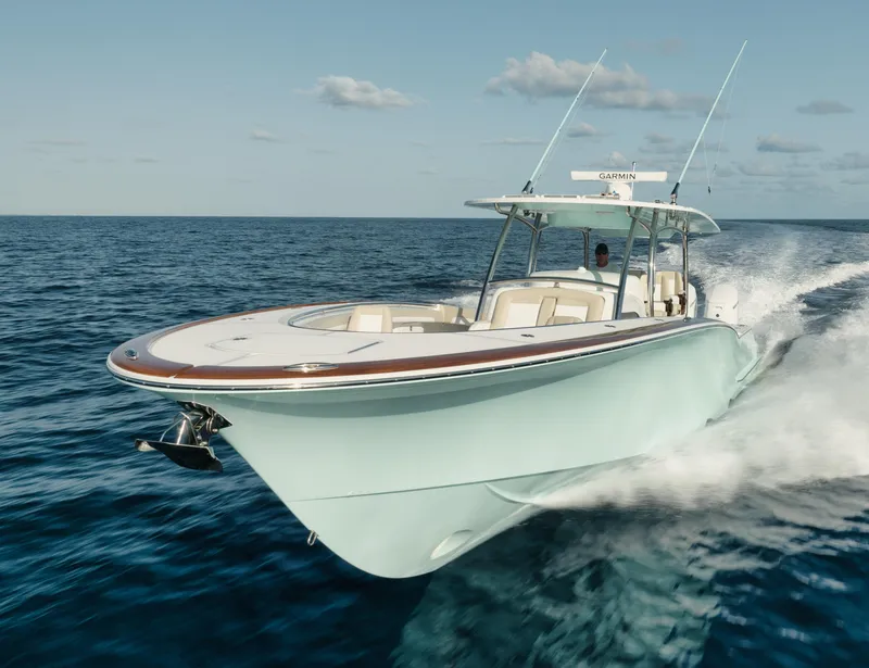 Slide: The Image of 2025 Mag Bay 43 CC cruising on open water. - 16