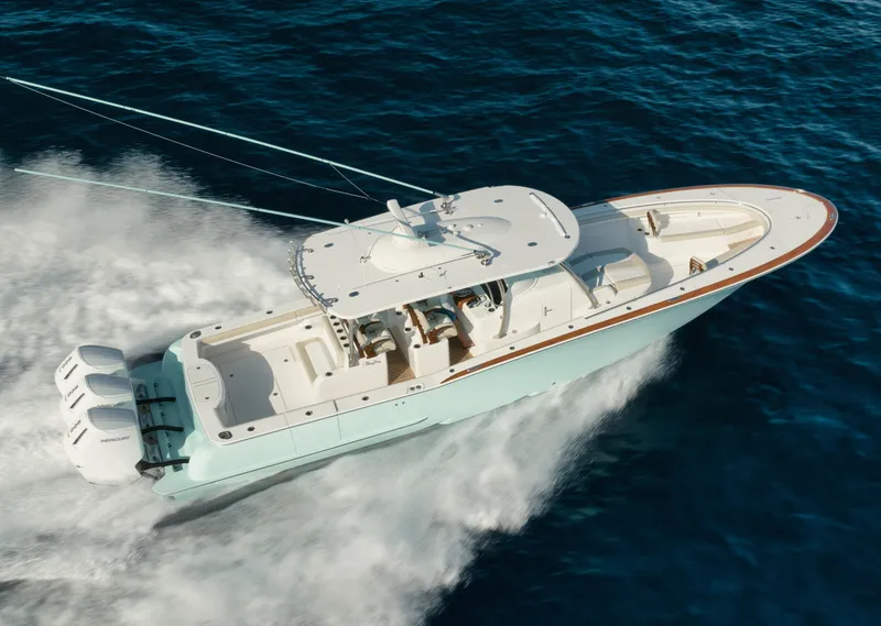 Slide: The Image of 2025 Mag Bay 43 CC boat cruising on open water. - 17