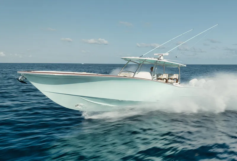 Slide: The Image of 2025 Mag Bay 43 CC cruising on open water. - 19