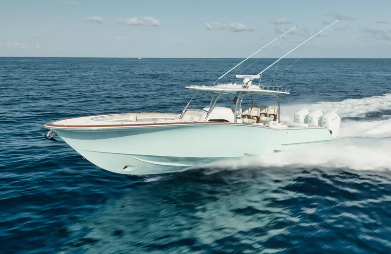 Slide: The Image of 2025 Mag Bay 43 CC cruising on open water. - 21