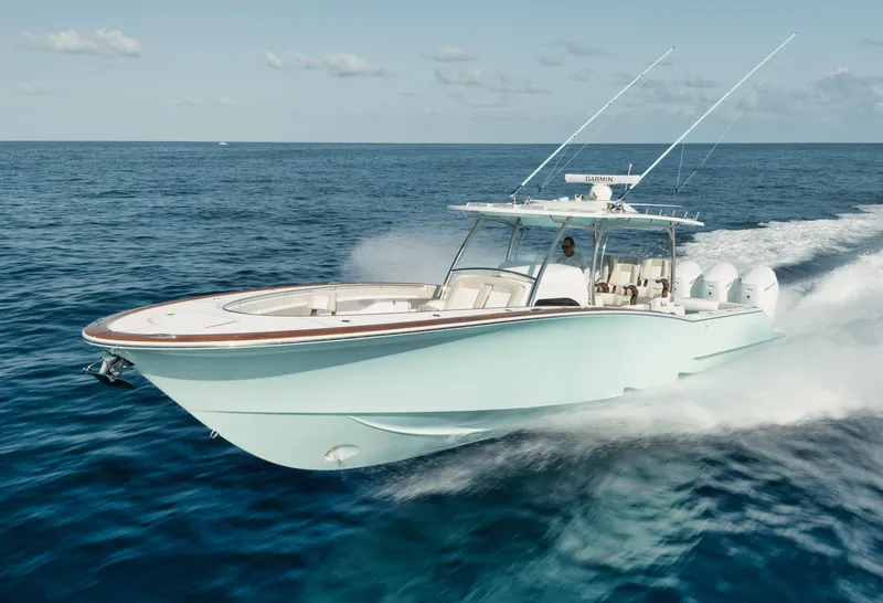 Slide: The Image of 2025 Mag Bay 43 CC boat cruising on open water. - 22