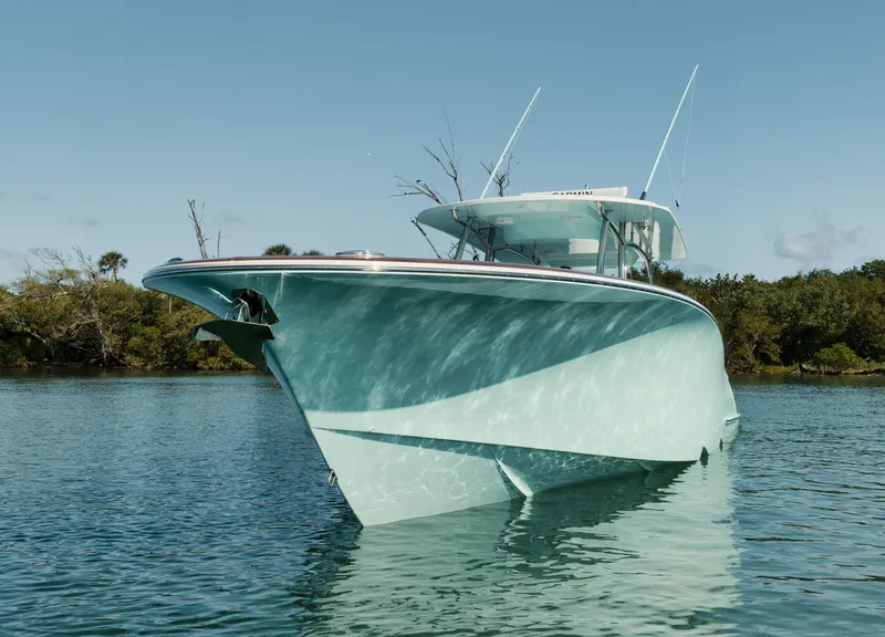 Slide: The Image of 2025 Mag Bay 43 CC boat on calm water. - 23