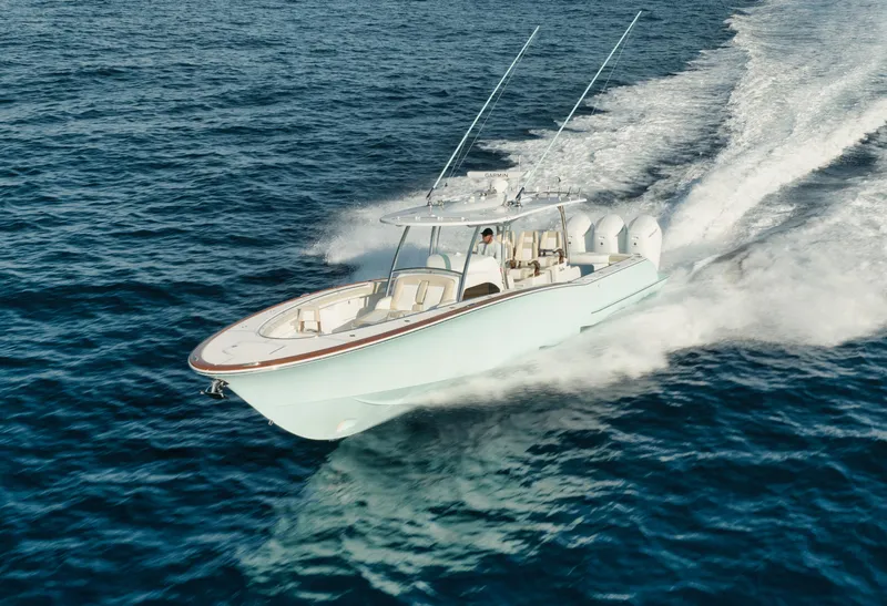 Slide: The Image of 2025 Mag Bay 43 CC cruising on open water. - 24