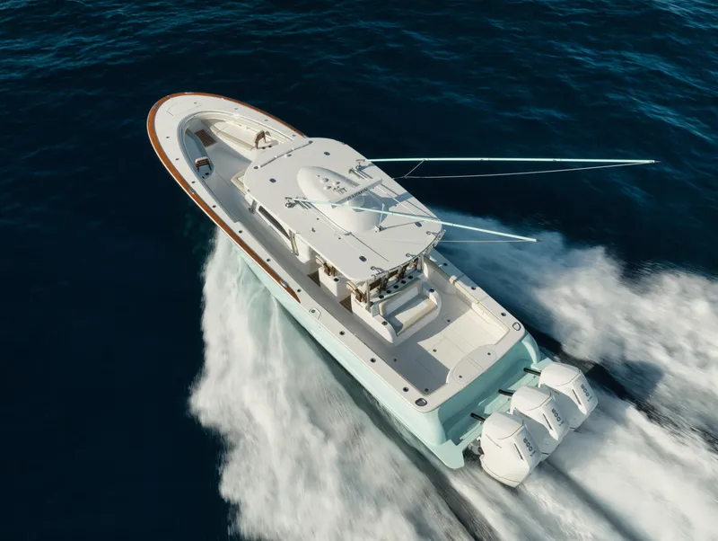 Slide: The Image of 2025 Mag Bay 43 CC boat cruising on open water. - 3