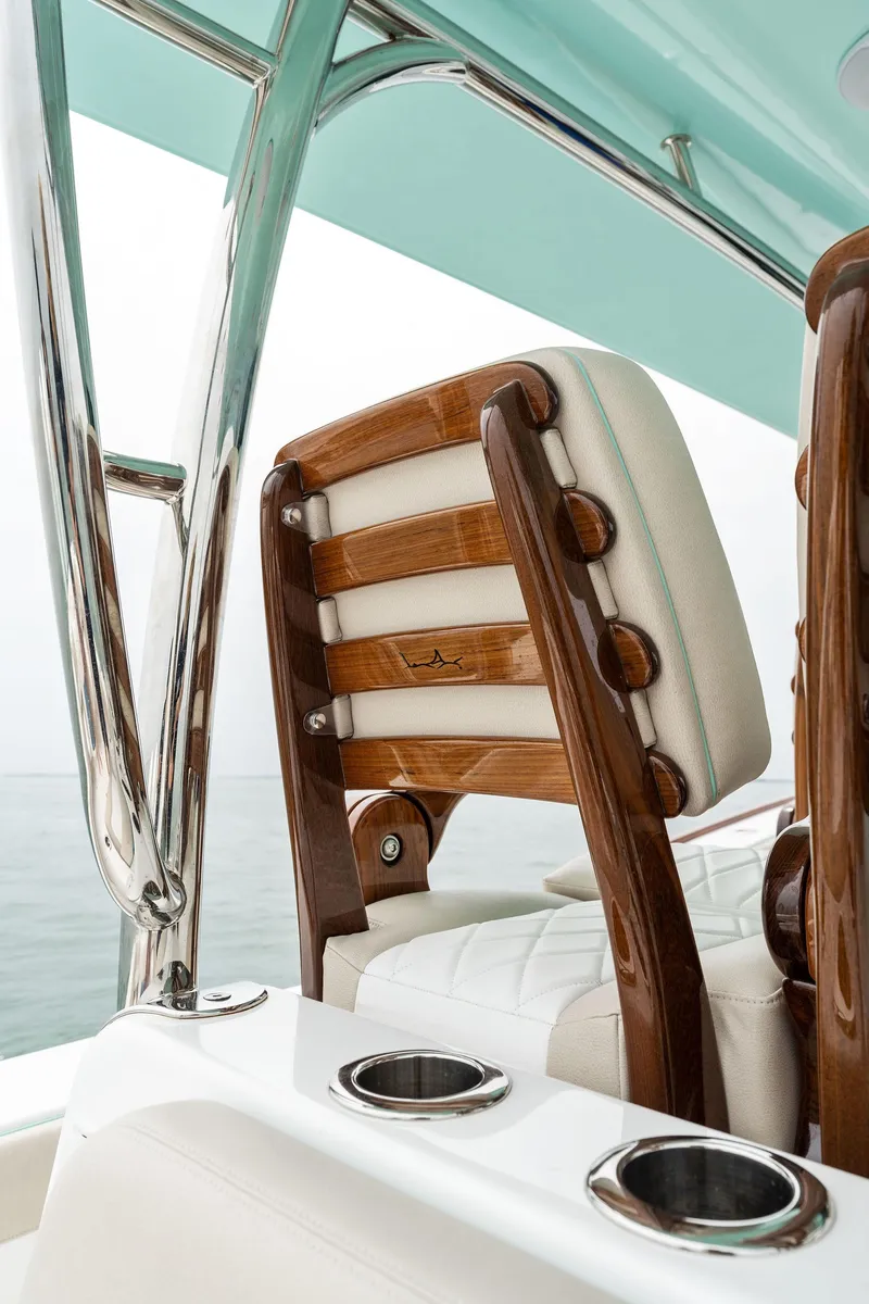 Slide: The Image of 2025 Mag Bay 43 CC boat with luxurious seating and polished wood accents. - 35