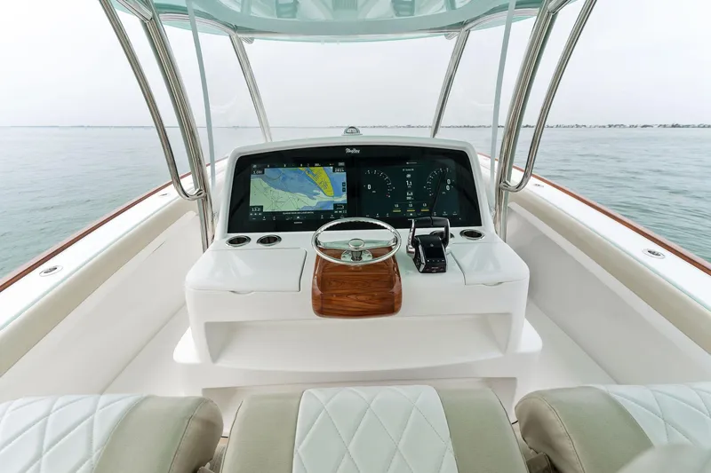 Slide: The Image of Helm of 2025 Mag Bay 43 CC boat with modern navigation system. - 37