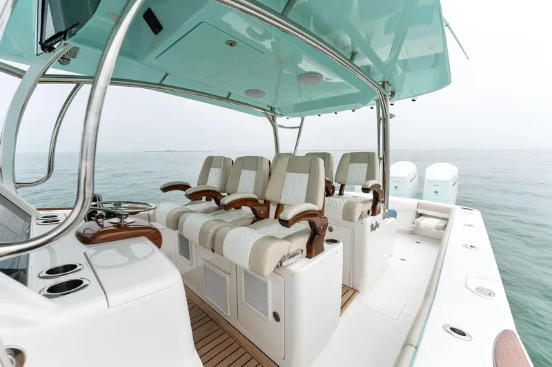Slide: The Image of 2025 Mag Bay 43 CC boat interior with luxurious seating and helm station. - 38