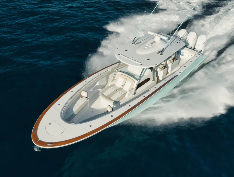 Slide: The Image of 2025 Mag Bay 43 CC boat cruising on open water. - 4