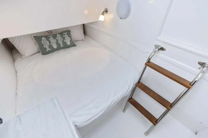 Slide: The Image of 2025 Mag Bay 43 CC cabin with bed and ladder - 44