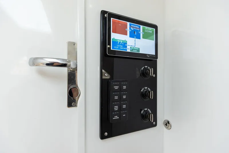 Slide: The Image of Control panel of 2025 Mag Bay 43 CC boat with touchscreen display. - 49