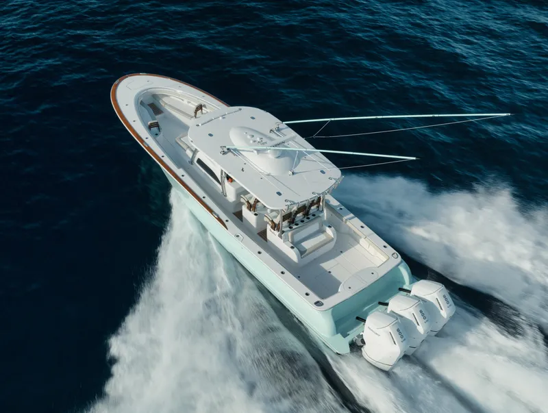 Slide: The Image of 2025 Mag Bay 43 CC boat cruising on open water. - 5