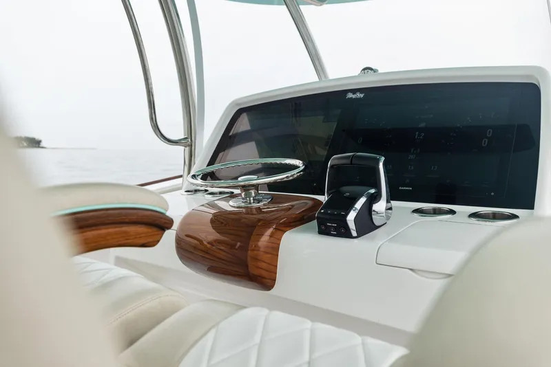 Slide: The Image of Helm of 2025 Mag Bay 43 CC boat with modern controls and luxurious design. - 50