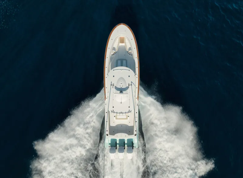 Slide: The Image of Aerial view of 2025 Mag Bay 43 CC boat cruising on open water. - 8