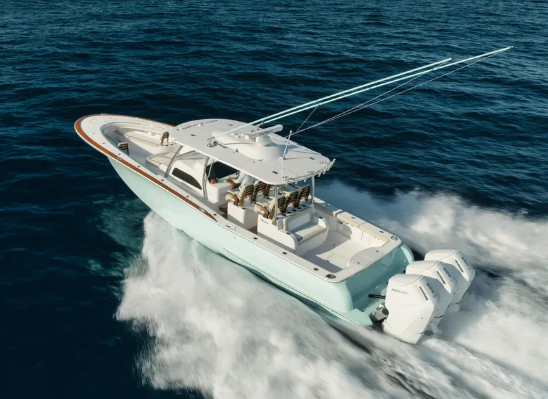 Slide: The Image of 2025 Mag Bay 43 CC boat cruising on open water. - 9