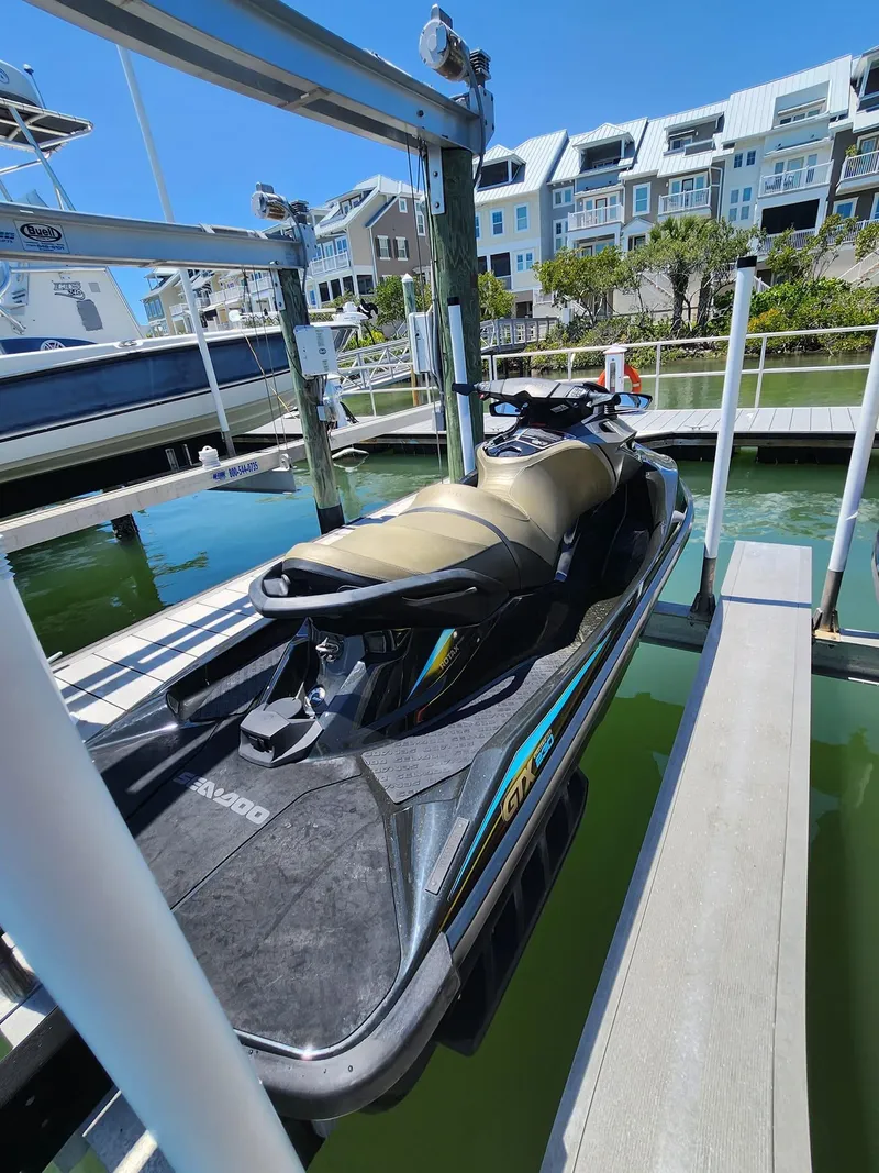 Slide: The Image of 2017 Sea-Doo Limited GTX jet ski docked at a marina. - 4
