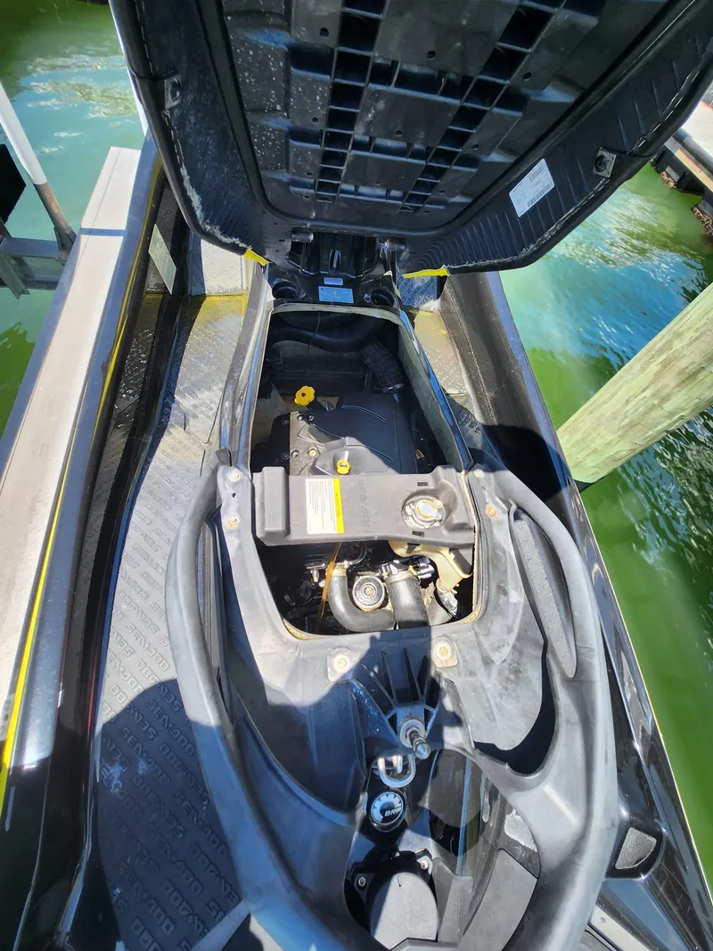 Slide: The Image of 2017 Sea-Doo Limited GTX with open engine compartment, docked by the water. - 5