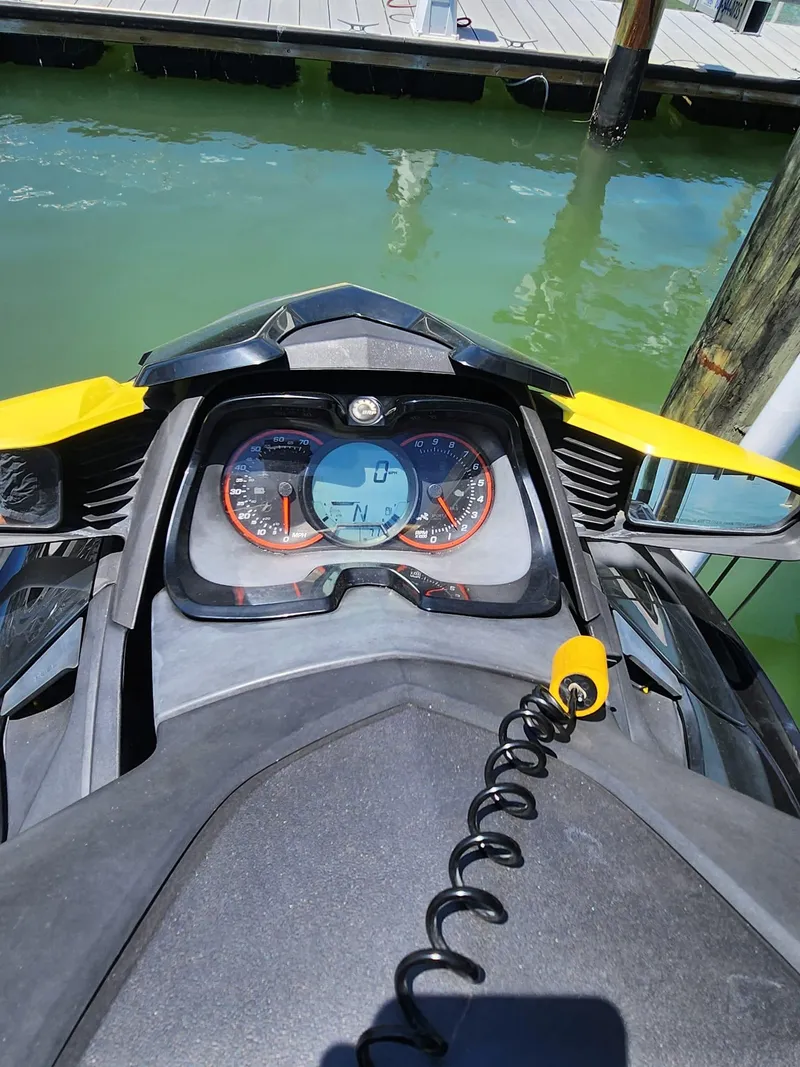 Slide: The Image of 2015 Sea-Doo RXT 260 dashboard view at a dock. - 4