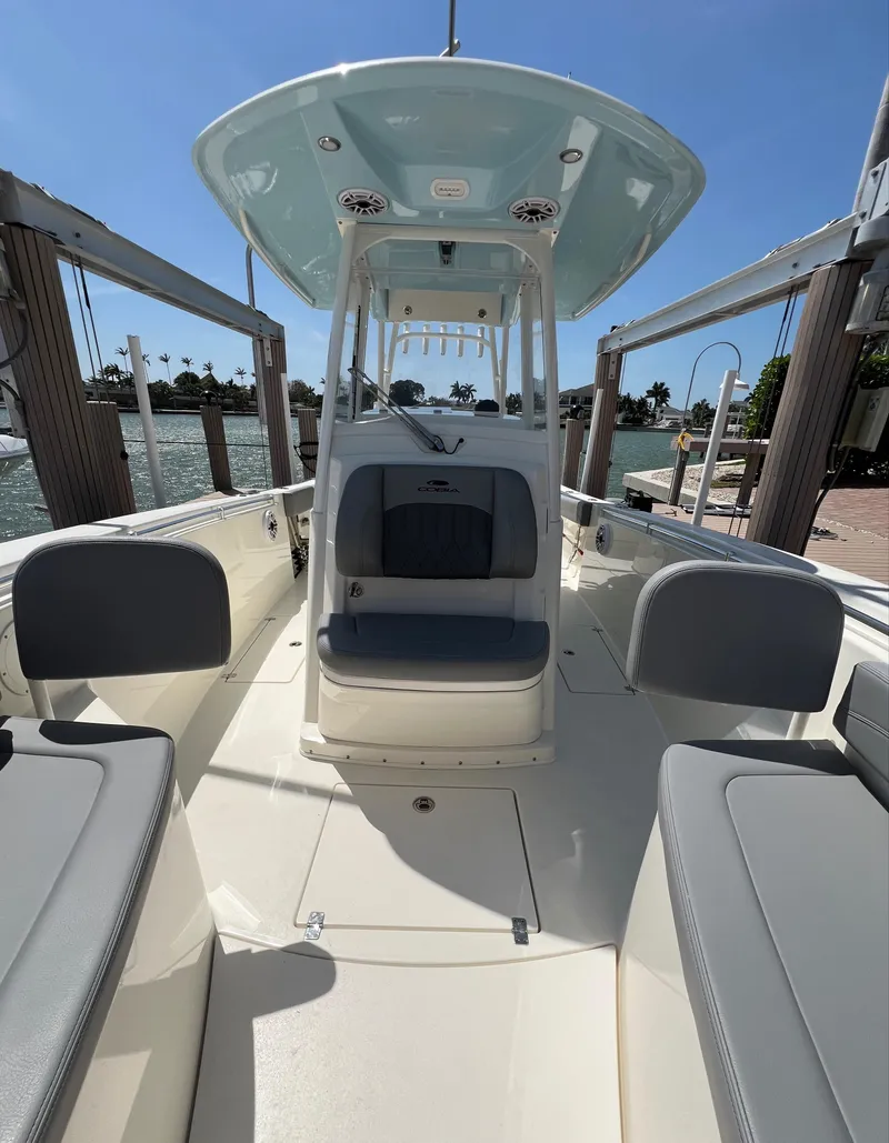 Slide: The Image of 2024 Cobia 301 Center Console boat with spacious seating and modern design. - 13