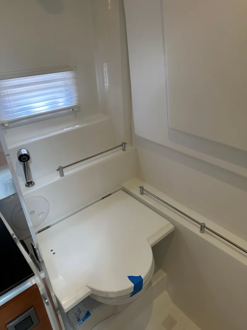 Slide: The Image of 2016 Jeanneau Leader 36 bathroom with modern fixtures and compact design. - 44