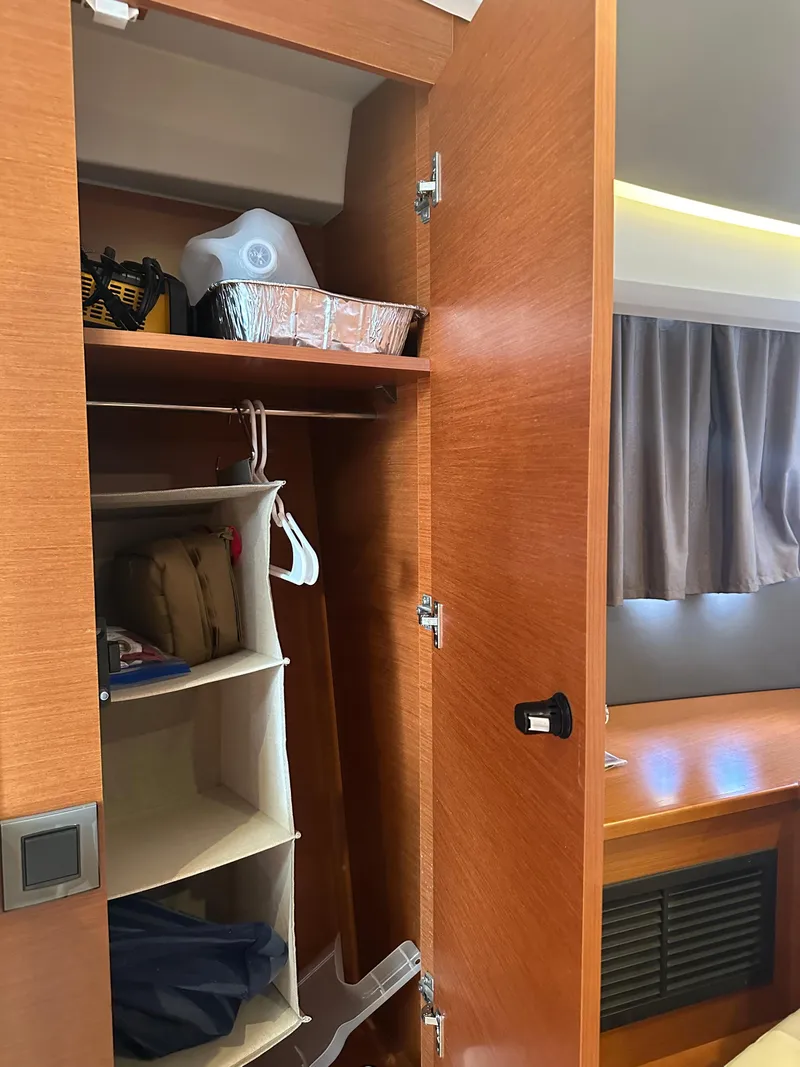 Slide: The Image of Wooden closet interior on a 2016 Jeanneau Leader 36 boat. - 48
