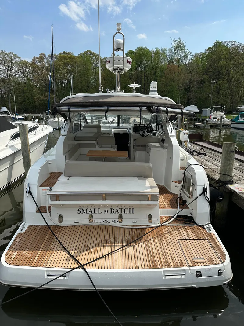 Slide: The Image of 2016 Jeanneau Leader 36 yacht docked at marina, rear view. - 6