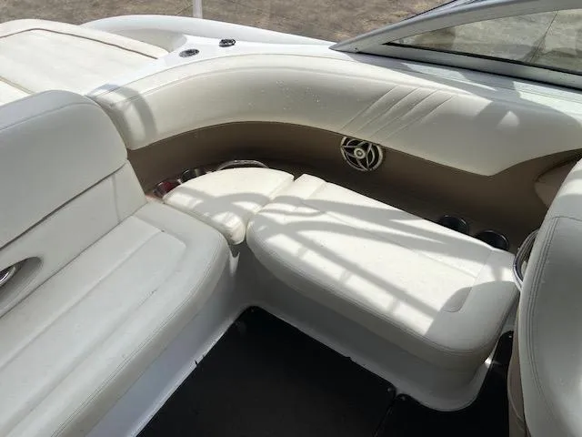 Slide: The Image of Interior seating of a 2008 Cobalt 222 boat with white and beige upholstery. - 11