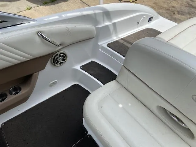 Slide: The Image of Interior of a 2008 Cobalt 222 boat with white leather seats and clean design. - 13