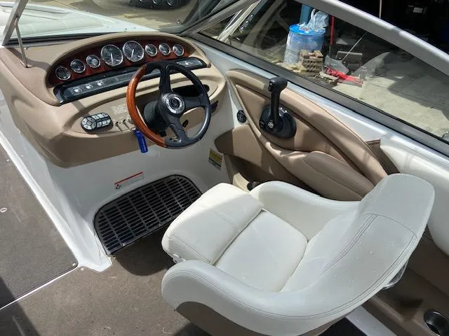 Slide: The Image of 2008 Cobalt 222 boat cockpit with steering wheel and control panel. - 14