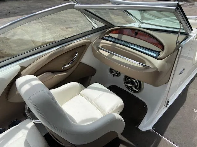 Slide: The Image of Interior of a 2008 Cobalt 222 boat with white and beige seating. - 15