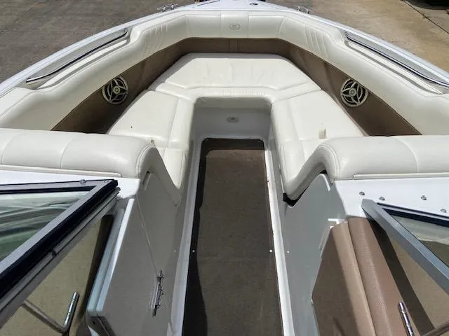 Slide: The Image of 2008 Cobalt 222 boat interior with white leather seating and speakers. - 16