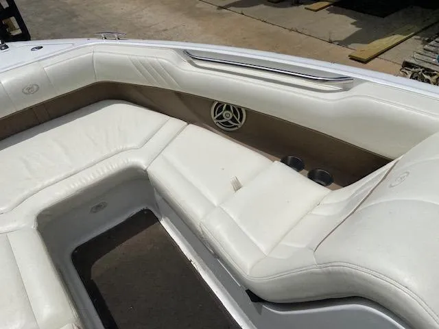 Slide: The Image of 2008 Cobalt 222 boat with white leather seating and built-in speaker. - 17