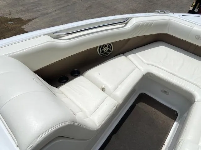 Slide: The Image of Interior seating of a 2008 Cobalt 222 boat with white leather upholstery. - 18