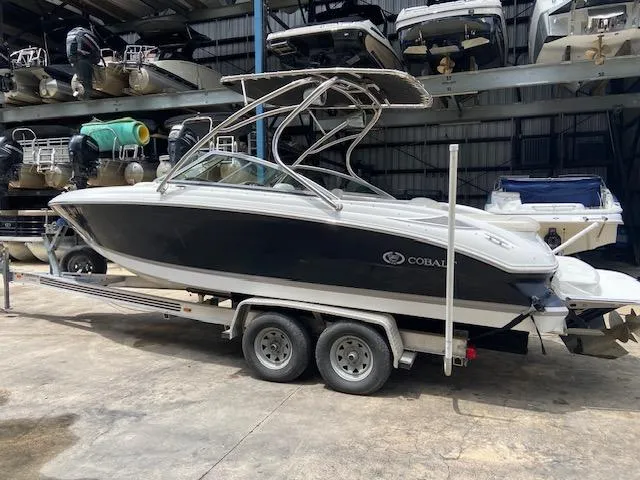 Slide: The Image of 2008 Cobalt 222 boat on a trailer in a storage facility. - 3